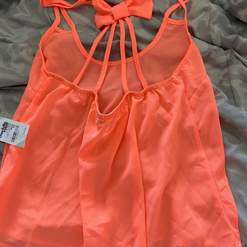 Tank top with bow on back straps.